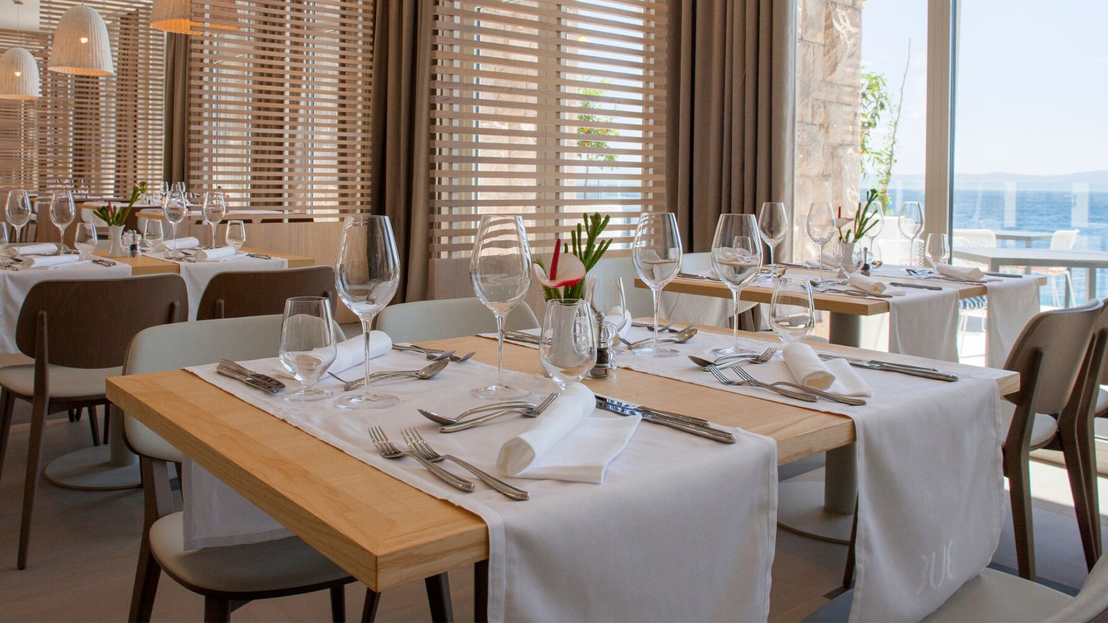 Fine dining restaurant table set with candles and silverware